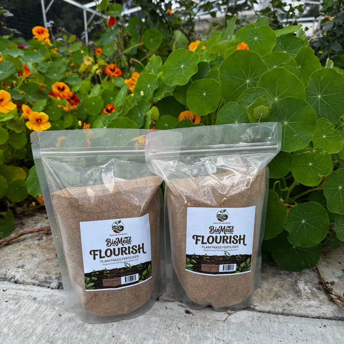 Two clear stand-up pouches of Bio Meal Flourish Palin Frass Fertiliser 1.5L